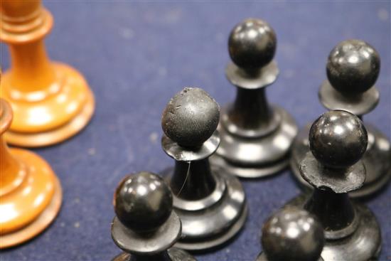 A Jaques Staunton boxwood and ebony chess set, knights and rooks stamped with a crown and the white king kings 8.5cm